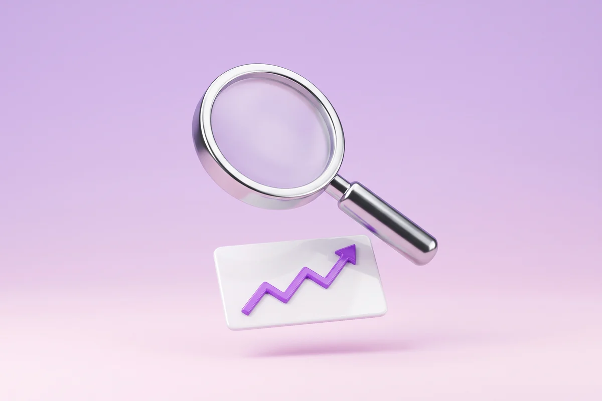 A magnifying glass over a rising e-commerce sales chart