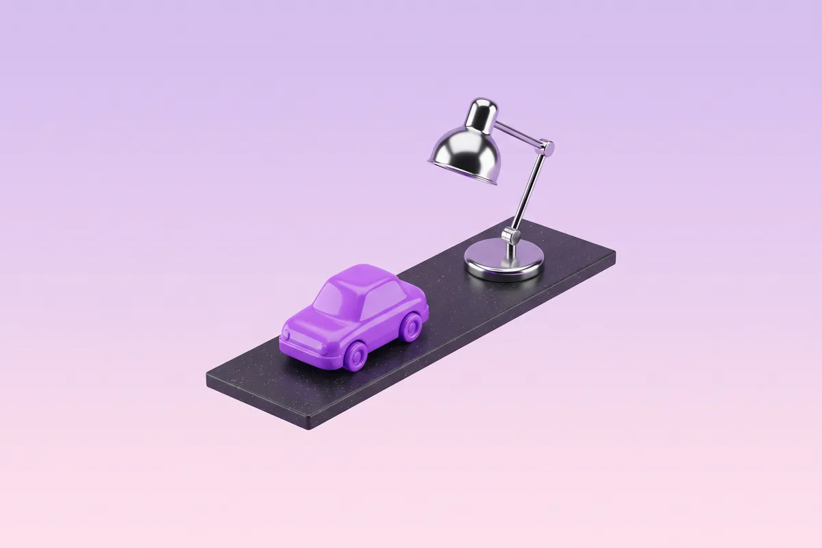 Spielzeugauto und Schreibtischlampe als Symbol für Arbeitsweg und Homeoffice in der Steuererklärung